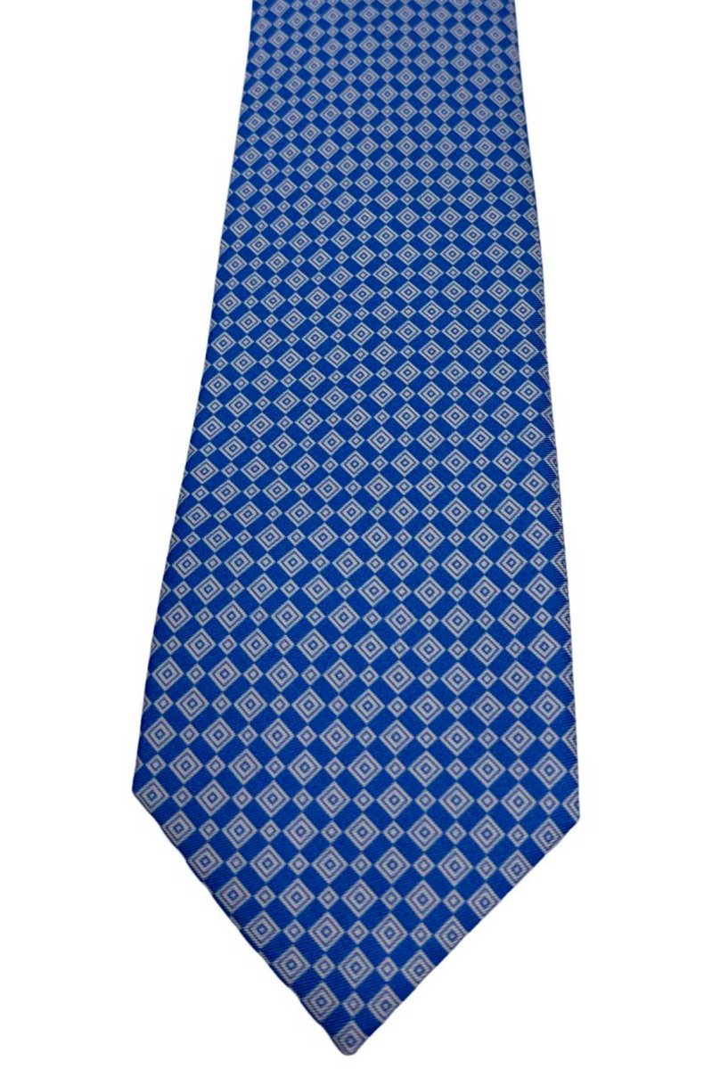 Cravatta uomo celeste fantasia in pura seta cucita a mano costruzione 3 piege larghezza 9cm