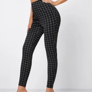 Pantaloni skinny a quadri con vita alta
