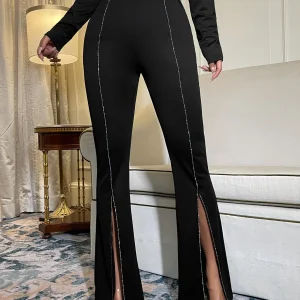 Pantaloni svasati con strass dettaglio catena orlo a fessura