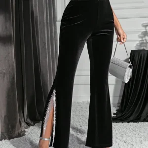 Pantaloni svasati con strass con frange a fessura alta di velluto