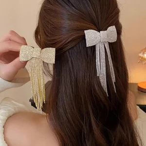 Fermaglio a fiocco con nappine di stras